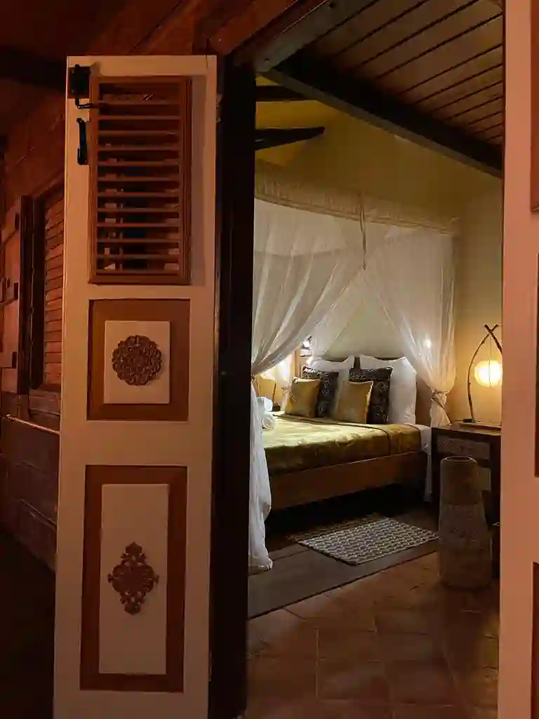 Two bedrooms with separate toilets and showers, queen-size bed, mosquito net, fan, and air conditioning.