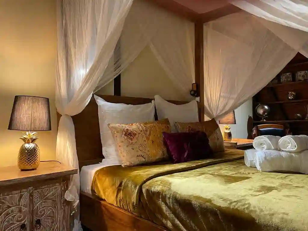 Two bedrooms with separate toilet and shower, queen-size bed, mosquito net, fan, and air conditioning